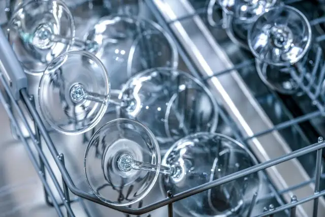 Clean glassware on a dishwasher rack