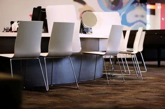 Bright salon with white styling chairs