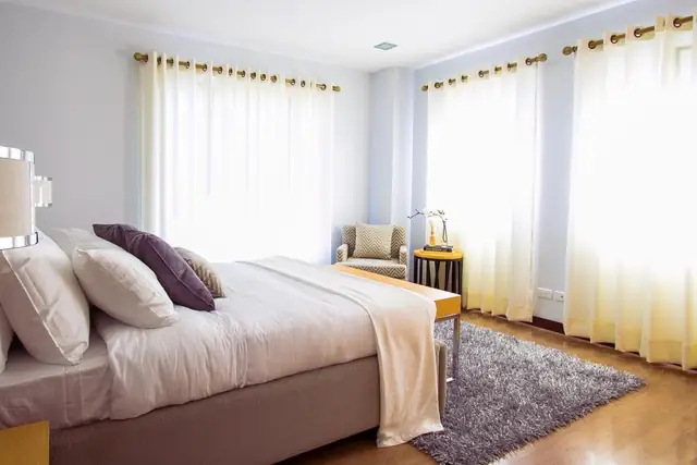 Bedroom with a shaggy gray area rug