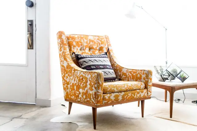 Patterned armchair in a bright room