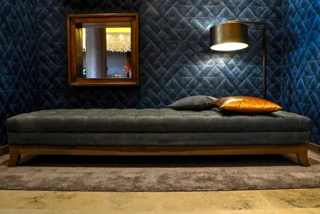 Lounge with a gray couch and patterned rug