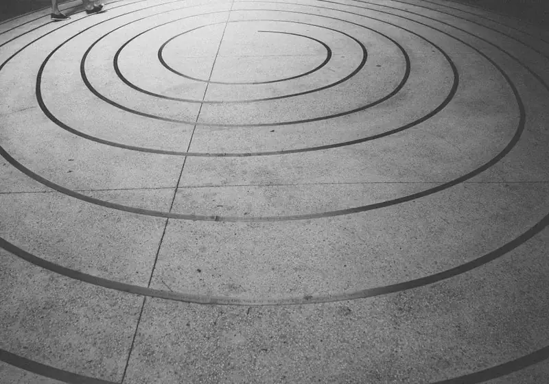 Circular decorative pattern cut into a concrete plaza