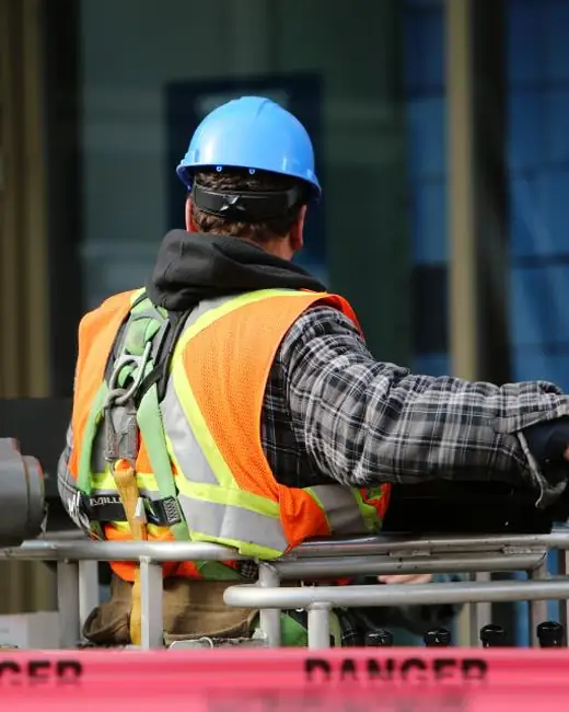 Concrete worker in a hard hat and safety vest