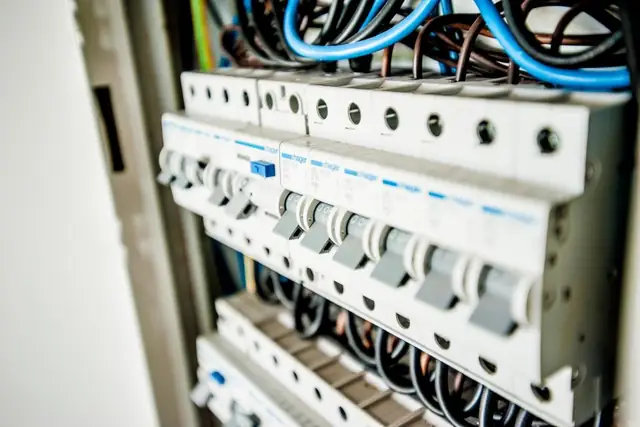 Row of breakers and wiring in an open panel