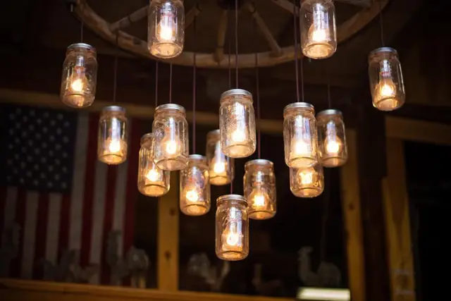 Mason jar pendant lights hanging from a wood ceiling