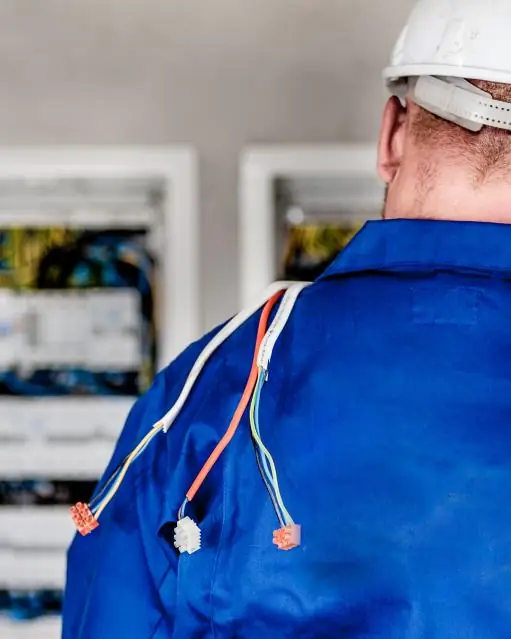 Tom, owner of Kettle Creek Electric, working on an electrical panel