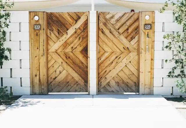 Pair of wooden chevron-pattern gates