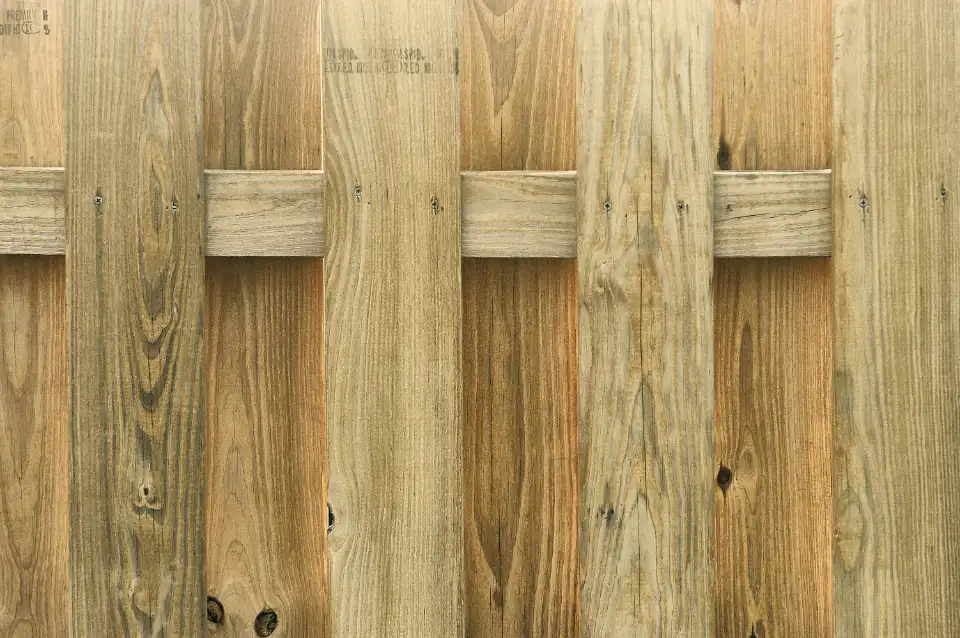 Close-up of a new light wood privacy fence