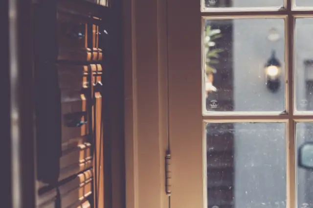 Sunlit entry with French doors and wood floor