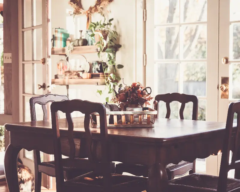 Dining room with a wooden table on warm hardwood floors