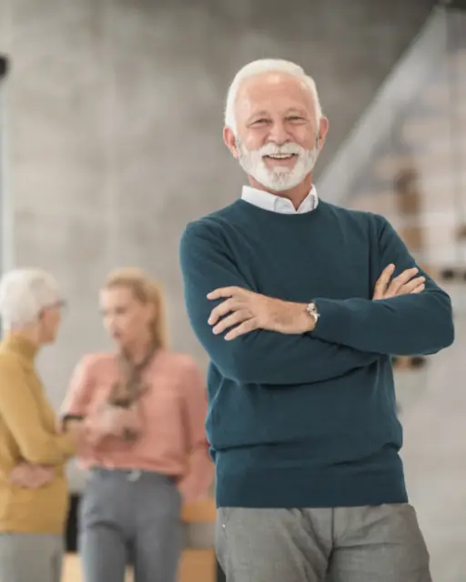 Walt, owner of Plank & Grain, standing with arms crossed