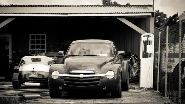 Open garage with cars parked inside