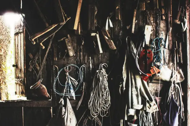 Hand tools hanging on a workshop wall