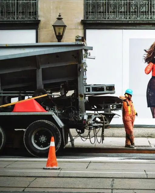 Jesse working with a ladder and truck on a job