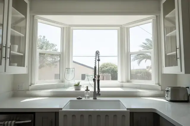 Bright kitchen with a farmhouse sink under a window