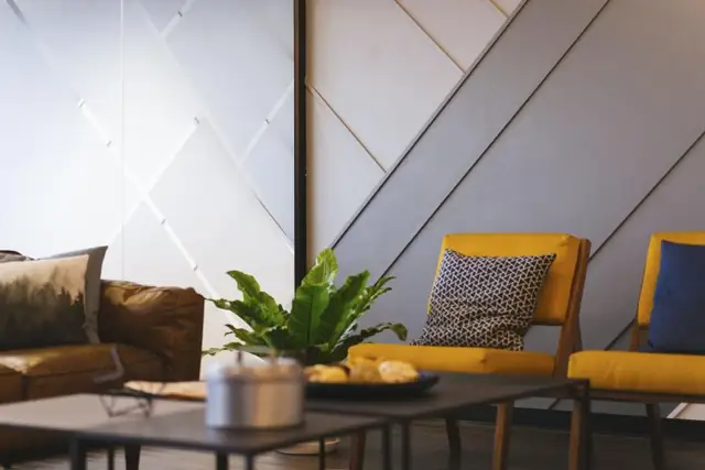 Tidy living room with yellow chairs