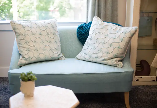 Light blue sofa with cushions