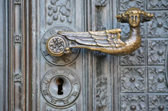 Ornate door handle with an old keyhole