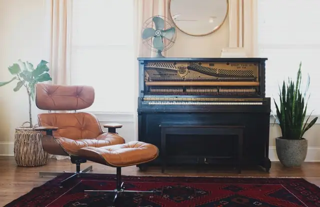 Upright piano in a bright living room
