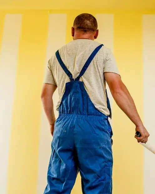 Dan at work painting a wall