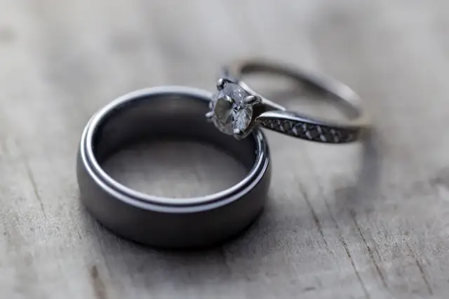 Two wedding rings resting on fabric