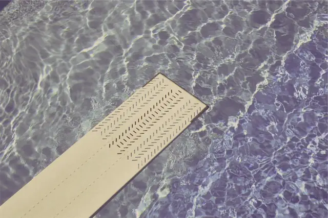 Diving board over a pool