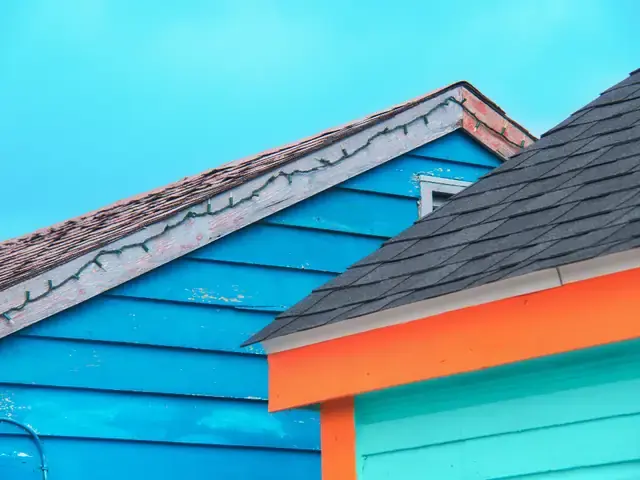 Colorful clapboard siding under blue sky
