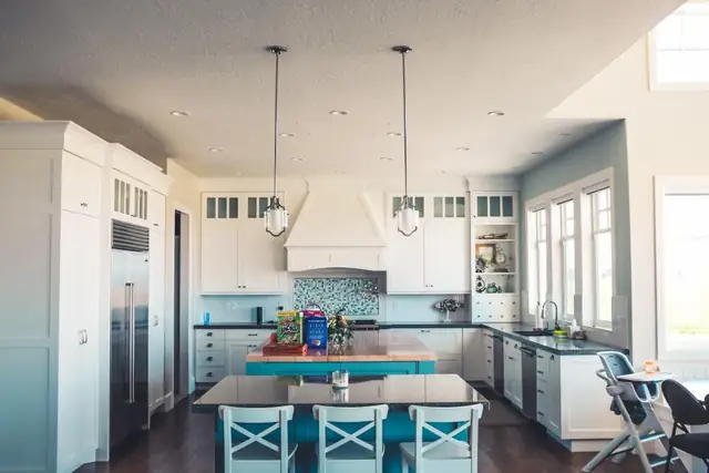 Bright kitchen with an island and pendant lights