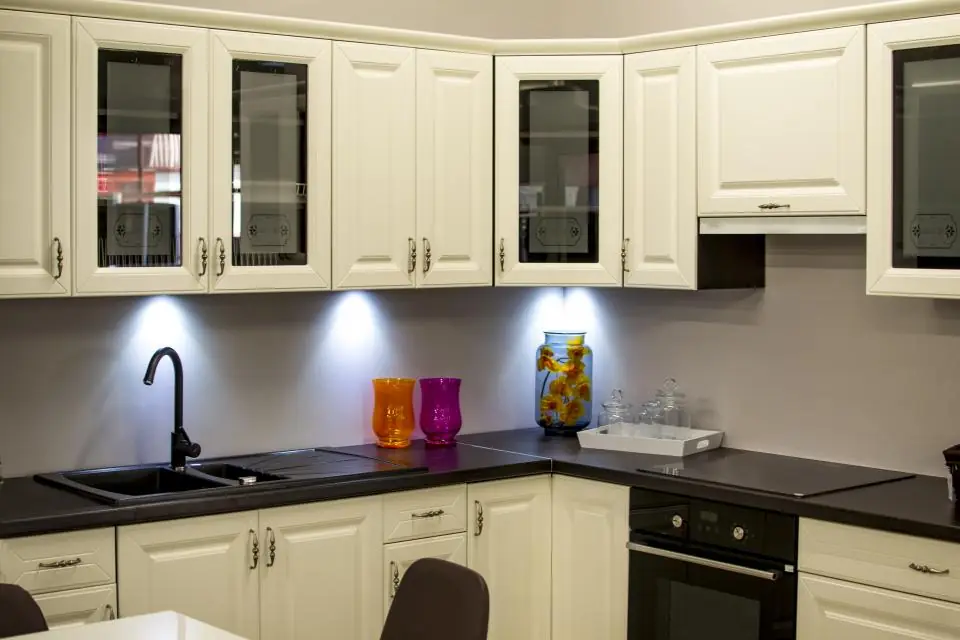 White kitchen cabinets with under-cabinet lighting